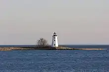 A black and white photograph of Black Rock Harbor Light