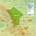 Traditional territory in green, reserves and reservations in orange.