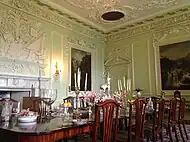 The dining room. The Dining Room was converted from the 16th century Great Hall by the second Duke as he turned the old castle into a Georgian mansion house Thomas Clayton’s plasterwork can be seen here and throughout much of the castle.