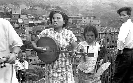 China, southern yueqin or possibly a zhongruan (中阮, lit. "medium ruan"), 1960. Southern yueqins had long necks, unlike the northern. This instrument lacks the large soundholes that are a trait of the ruan. These are being revived in Taiwan.