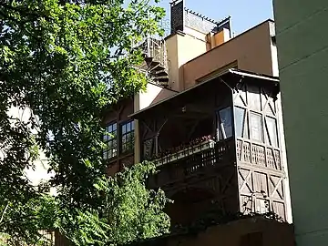 Wooden balcony and loggia onto the park