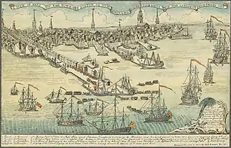 A wide view of a port town with several wharves. In the foreground, there are eight large sailing ships and an assortment of smaller vessels. Soldiers are disembarking from small boats onto a long wharf. The skyline of the town, with nine tall spires and many smaller buildings, is in the distance. A key at the bottom of the drawing indicates some prominent landmarks and the names of the warships.