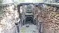 Neglected stepwell filled with debris