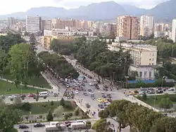 The boulevard crossing from west to east at the lower portion of the picture, passing the Skanderbeg Square.