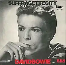 The cover art of the 1976 single release of David Bowie's "Suffragette City"