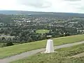 The town of Dorking and its section of the Vale of Holmesdale from Box Hill in the North Downs, with more heavily wooded Greensand Hills beyond.  These sets of hills make up the Surrey Hills AONB.