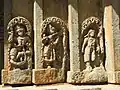 Defaced reliefs on the outer wall, Krishna in the center