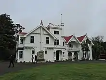 A view of the exterior of a large, grand white house at Brancepeth Station