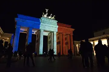 The Gate lit up with the colors of the French Flag after the November 2015 Paris attacks