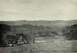 Country landscape with large barn