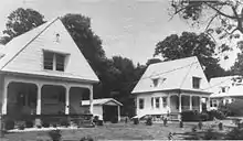 Three similar houses, with porches and garages