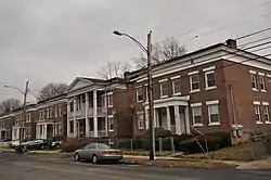 Remington City rowhouses on Bond Street. Built for workers during WW1, emulates European cottage styles.