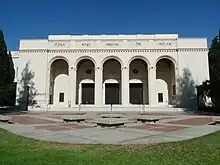 Exterior of auditorium with large white pillars