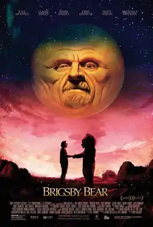 A man and a person in a bear costume shake hands below a large sun with a face.