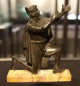 A Roman bronze figurine depicting a kneeling Germanic man adorned with a Suebian knot Bibliothèque nationale de France