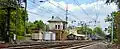 Panoramic view of Bryn Mawr station looking east with 1895 Interlocking Control Tower as Amtrak's daily westbound run of its New York to Pittsburgh Pennsylvanian passes on Track 3.