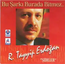 Erdoğan in front of a red background representing prison cell window.