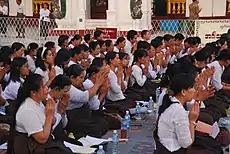 Image 24A group of Buddhist worshipers at Shwedagon Pagoda, an important religious site for Burmese Buddhists. (from Culture of Myanmar)