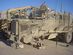 A Buffalo that survived with its cabin intact after an IED attack took its two front wheels and axle off