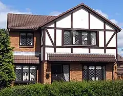 Image 29A 21st-century detached Mock Tudor house in Scotland. Its timber framing is typical of English Tudor architecture. (from Culture of the United Kingdom)