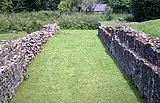 Remains of the lay brothers' range to the west of the cloister, showing the substantial undercroft.