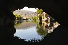 Image 4The cave of source of the Buna can be entered by boat and dived through a cave system serving as an effluence of the Zalomka. (from Subterranean river)