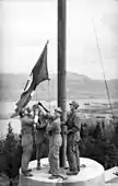 Germans raising the flag of Nazi Germany over Split