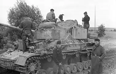 Panzer IV tank equipped with the Nebelwurfgerät behind the Schürzen.