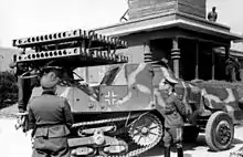 A weapons demonstration of a 24-round 8 cm Rakaten-Vielfachwerfer on an armoured SOMUA MCG half-track. Located in Northern France, Atlantic Coast, Riva Bella, 30 May 1944.