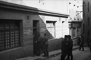 A synagogue used as a brothel. Three German soldiers can been seen entering