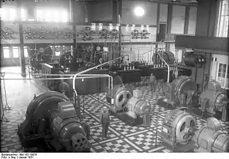 Alternator radio transmitters.  The two in center were the 100 kW units from 1913. The two on the sides were the 400 kW units installed 1916.  At rear are the frequency doubler transformers and tank circuits