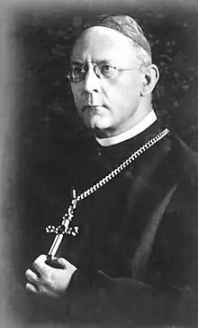 Cardinal Bertram, holding his clerical cross