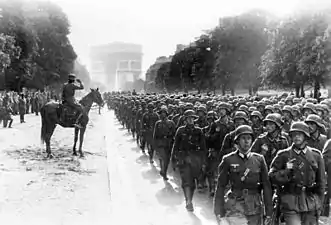 German soldiers of the 30. Infanterie-Division march on Avenue Foch on 14 June, 1940 (Bundesarchiv)