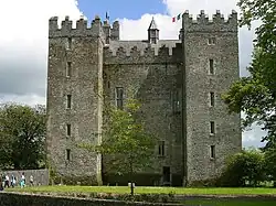 A big tower house with square corner towers.