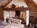 A fireplace in a German castle showing a brick hob.