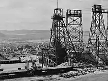 Image 6Mining headframes in Butte, MT (from History of Montana)