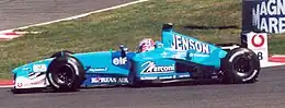 For its final years prior to the takeover of Renault, Benetton received sponsorship from Renault, Vodafone and Korean Air; this is Jenson Button driving in 2001 for Benetton