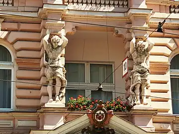 Atlantes on main facade, 1st floor balcony