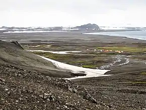 South Beaches on Byers Peninsula, Livingston Island, with Camp Byers in the foreground, and left to right Tsamblak Hill, Negro Hill and Dometa Point in the background