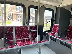 The interior of a CABS bus, with dividers installed on seats due to the COVID-19 pandemic