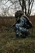 A sniper from the French CENZUB opposing force. The camouflage pattern is different from the other French patterns.