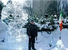 Mexican ice sculptor Abel Ramírez Águilar with one of his ice sculptures