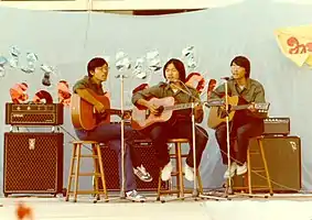 The band performing onstage in HK City Hall