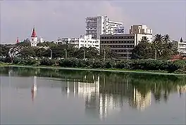 A view of CSI Church and LIC building, Ukkadam lake is in the foreground