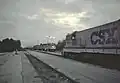 The Silver Meteor arrives at the station where a CSX B30-7 is waiting in 1986.