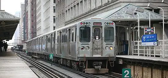 Image 40A Howard bound Red Line train temporarily rerouted to elevated tracks at Randolph station, Chicago. Photo credit: Daniel Schwen (from Portal:Illinois/Selected picture)