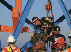 Attaching a strand to the hauling frame.