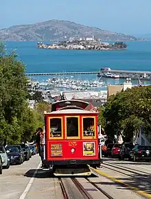 A cable car on a steep urban street