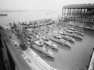 Image 12A fleet of naval forces being constructed in the Camden shipyards (1919) (from History of New Jersey)