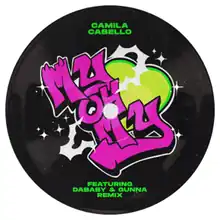 A black vinyl record is displayed on a white background, with the song's title written in pink graffiti in front of a green heart. Cabello's name is written in green text on top of the record, while DaBaby and Gunna are displayed underneath in green text.